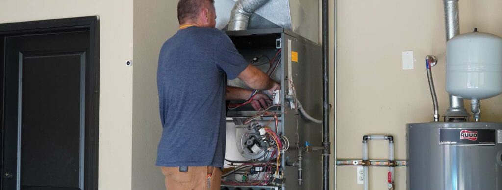 HVAC-Technician-performing-maintenance